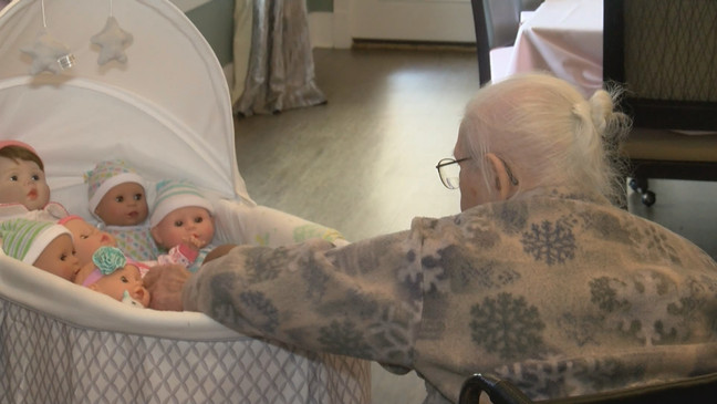 Dominion of Bristol | Residents nursing a baby doll
