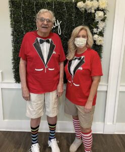 Dominion of Richmond | Senior resident and caretaker dressed in the same red shirt that looks like a suit