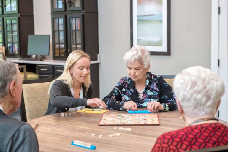 Dominion Senior Living | Residents playing games with associate